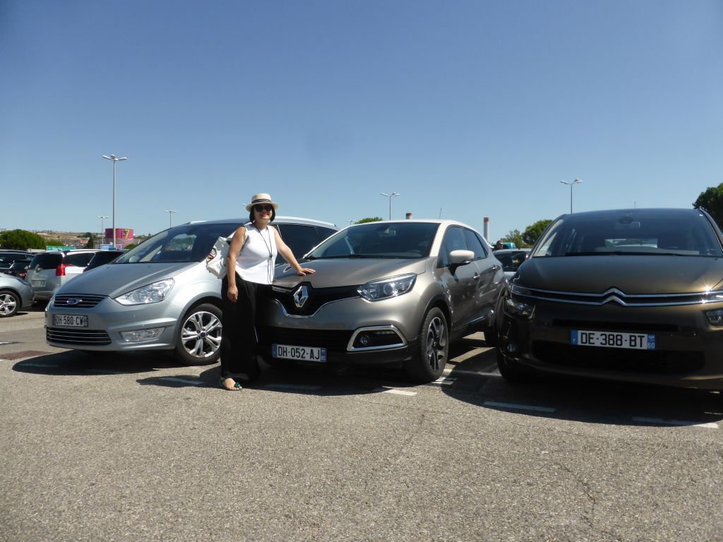 Miaomiao with our rental car at the parking place of Marseille Provence Airport