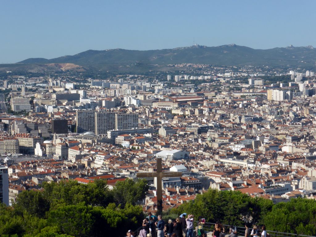 Wooden cross at the square in front of the Notre-Dame de la Garde basilica and the city center, viewed from the road to the Notre-Dame de la Garde basilica