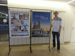 Tim with two posters at the ground floor of the entrance building to the Notre-Dame de la Garde basilica