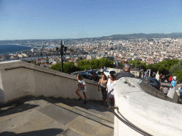 The staircase to the Notre-Dame de la Garde basilica and a view on the city center
