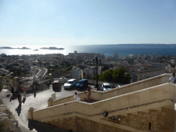 The staircase to the Notre-Dame de la Garde basilica and a view on the Pomègues and Ratonneau islands and the Château d`If castle