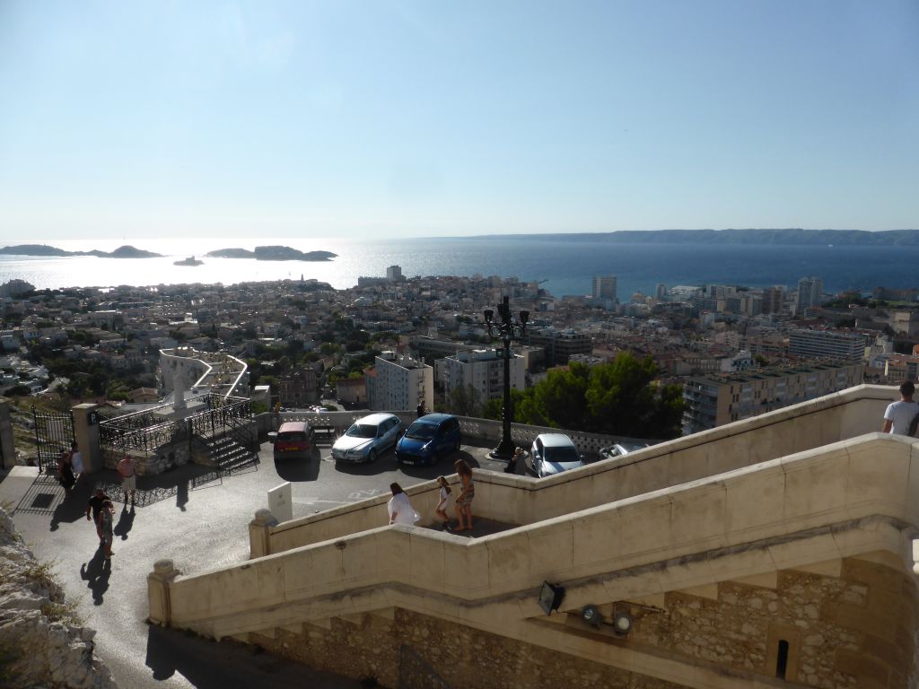 The staircase to the Notre-Dame de la Garde basilica and a view on the Pomègues and Ratonneau islands and the Château d`If castle