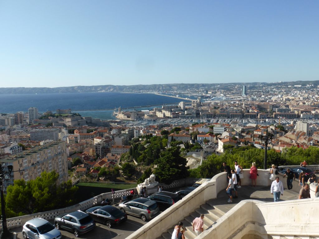 The staircase to the Notre-Dame de la Garde basilica and a view on the Old Port, the harbour of Marseille, the CMA CGM Tower and the Marseille Cathedral