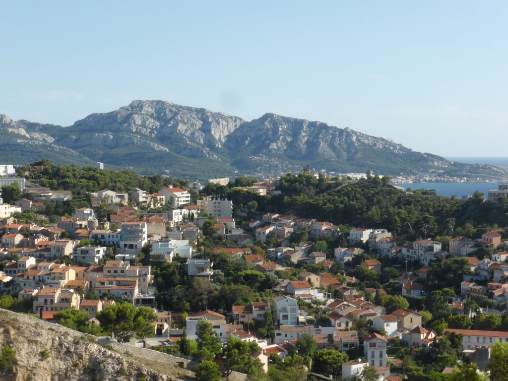 The Massif des Calanques mountain range and the south side of the city, viewed from the southwest side of the square around the Notre-Dame de la Garde basilica