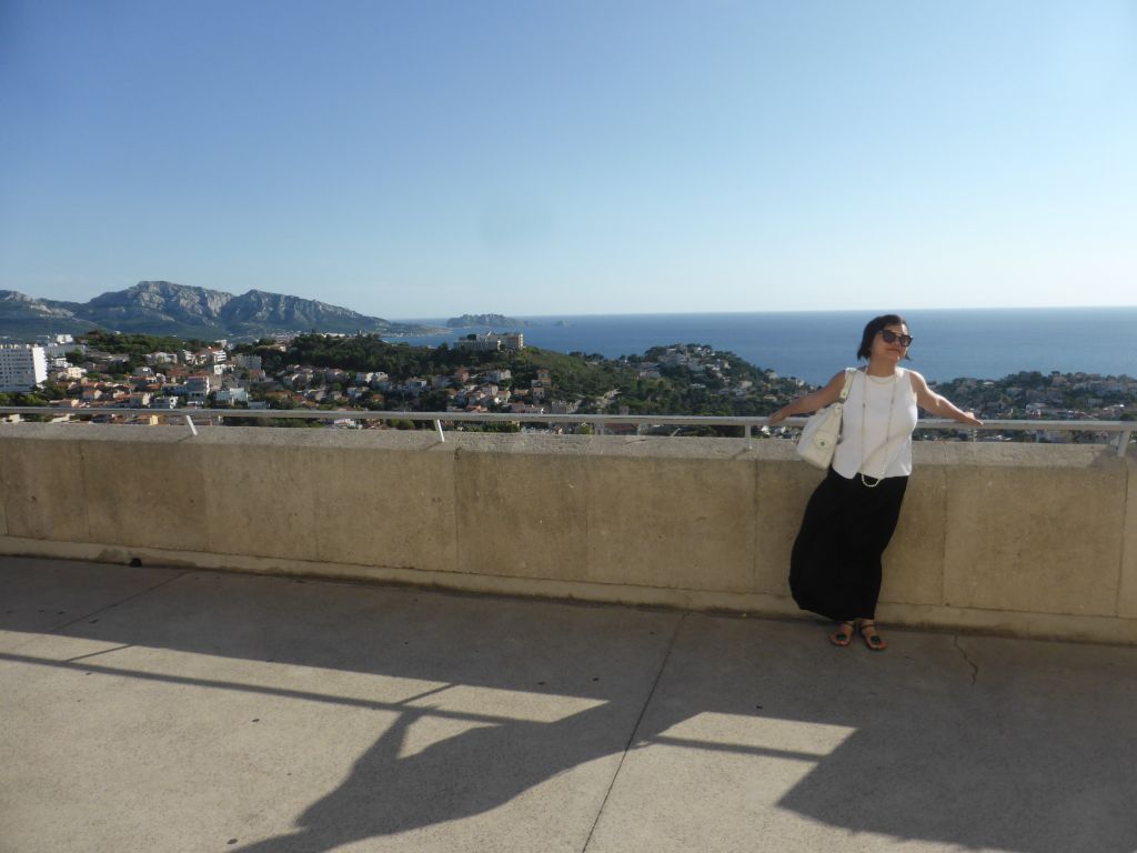 Miaomiao at the southwest side of the square around the Notre-Dame de la Garde basilica, with a view on the Massif des Calanques mountain range and the south side of the city