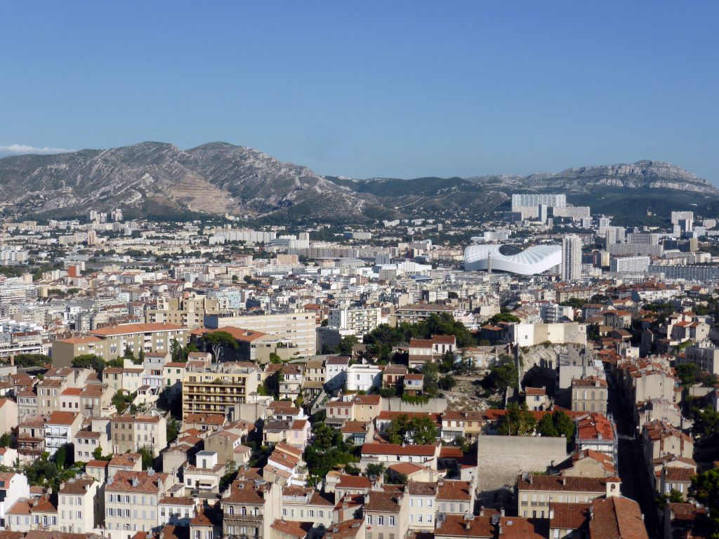 The Stade Vélodrome stadium and surroundings and the Mont Puget mountain, viewed from the southeast side of the square around the Notre-Dame de la Garde basilica