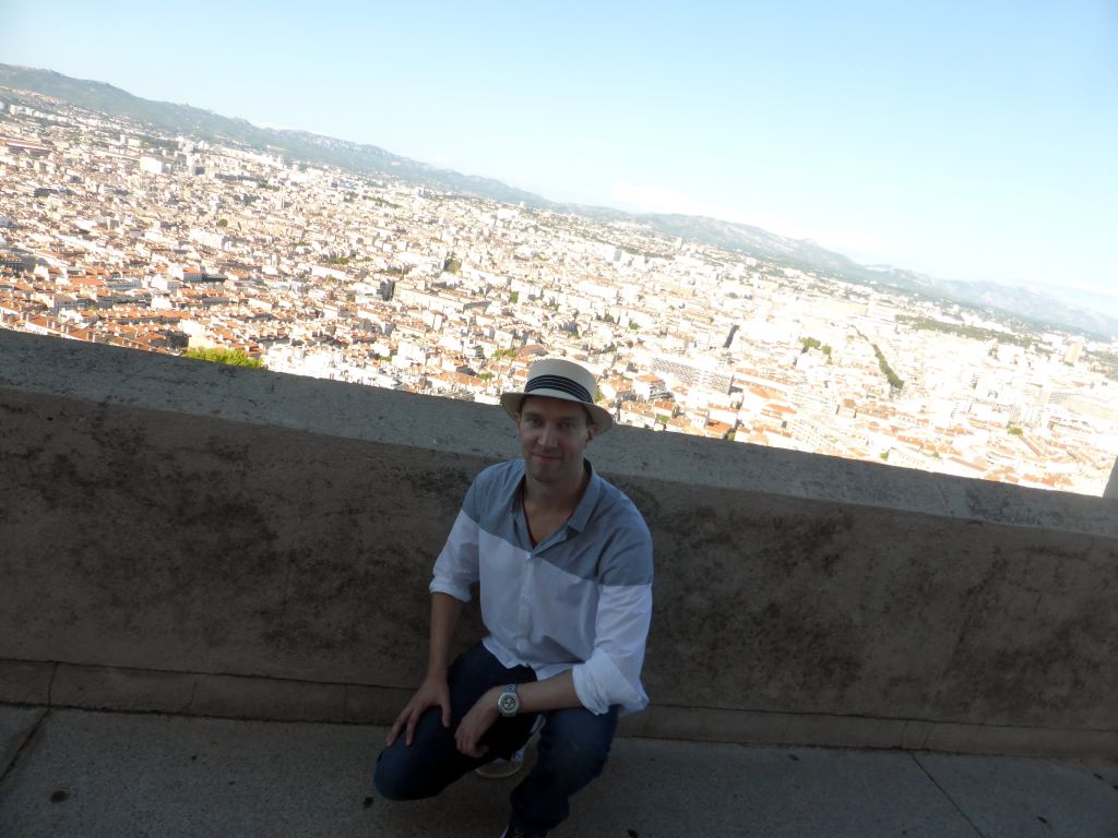 Tim at the northeast side of the square around the Notre-Dame de la Garde basilica, with a view on the city center