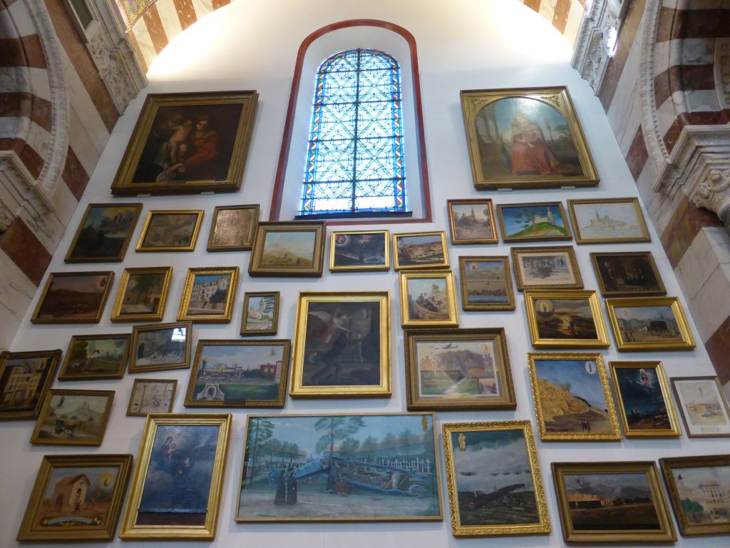 Paintings and stained glass window at the third left side chapel of the Notre-Dame de la Garde basilica