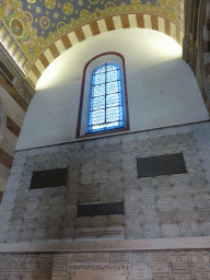 Tiles and stained glass window at the first left side chapel of the Notre-Dame de la Garde basilica