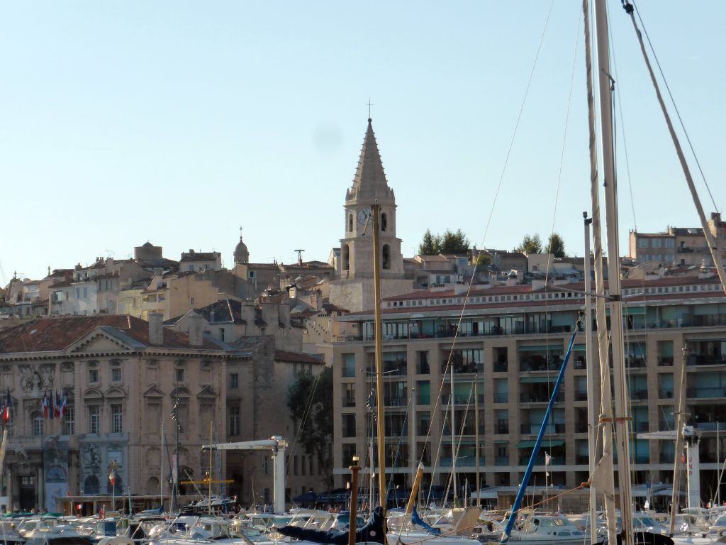 Boats in the Old Port, the City Hall and the tower of the Église Notre-Dame-des-Accoules, viewed from the tourist train from the Notre-Dame de la Garde basilica to the city center