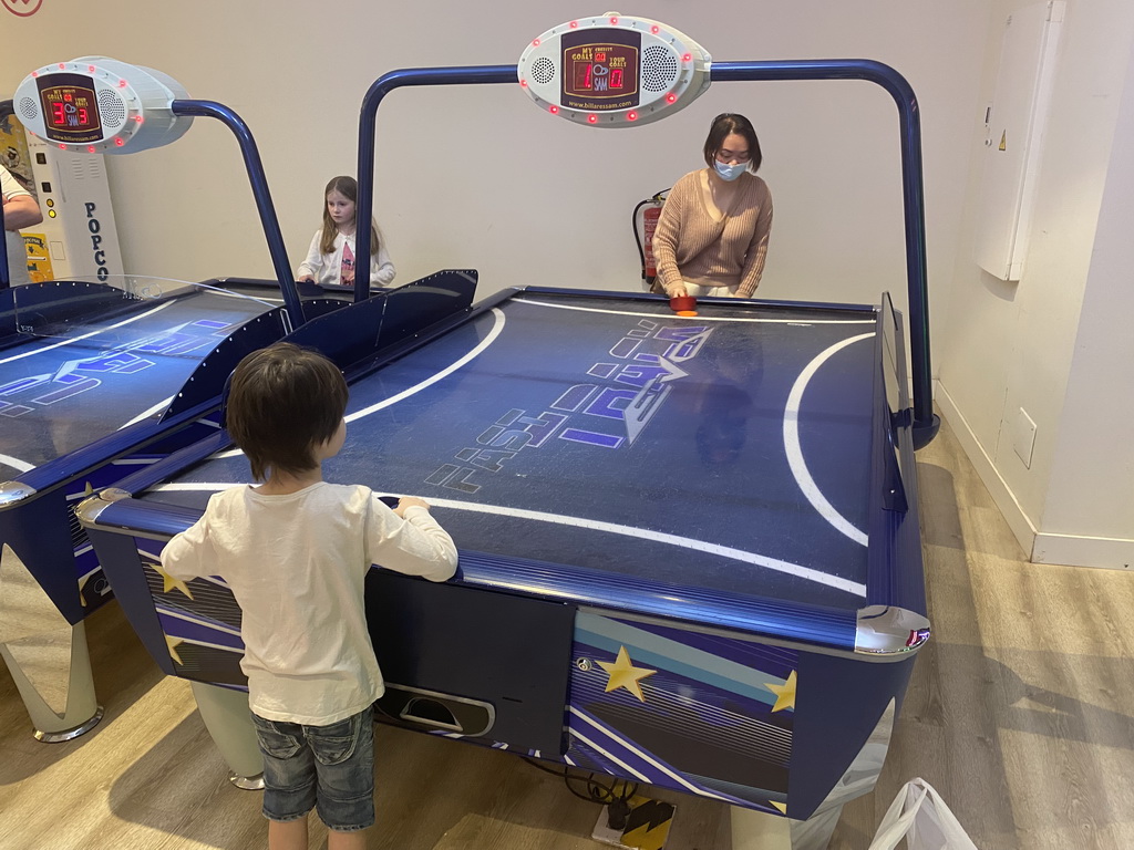 Miaomiao and Max playing air hockey at the gaming room at the Abora Buenaventura by Lopesan hotel