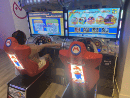 Miaomiao and Max playing `Mario Kart` at the gaming room at the Abora Buenaventura by Lopesan hotel