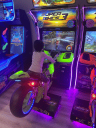 Max playing `Super Bikes 3` at the gaming room at the Abora Buenaventura by Lopesan hotel