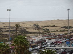 The Maspalomas Dunes and restaurants at the Calle las Dunas street, viewed from the Paseo Costa Canaria street