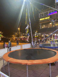 Max jumping at the bungee trampoline at the Yumbo Centrum shopping mall, by night