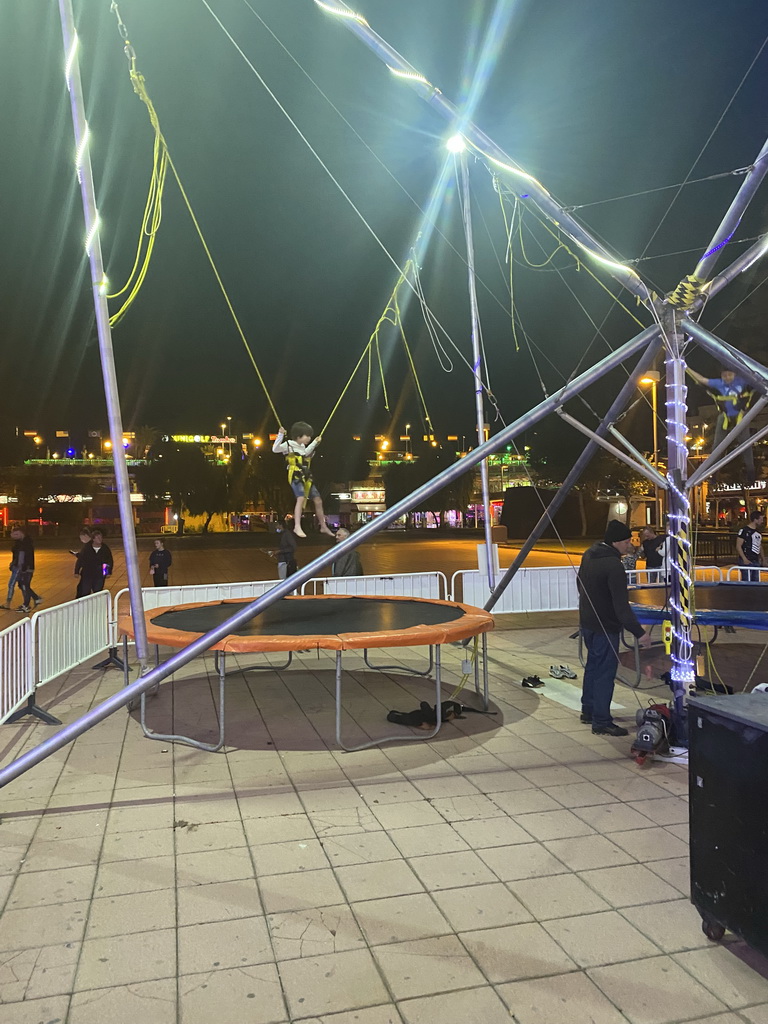 Max jumping at the bungee trampoline at the Yumbo Centrum shopping mall, by night