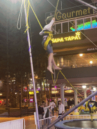 Max jumping at the bungee trampoline at the Yumbo Centrum shopping mall, by night