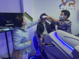 Miaomiao and Max doing a virtual reality motor cycle game at the VR Arena at the Yumbo Centrum shopping mall