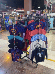 Football shirts at a shop at the Yumbo Centrum shopping mall, by night
