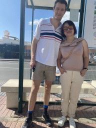 Tim and Miaomiao at the bus stop at the Avenida de Gran Canaria street