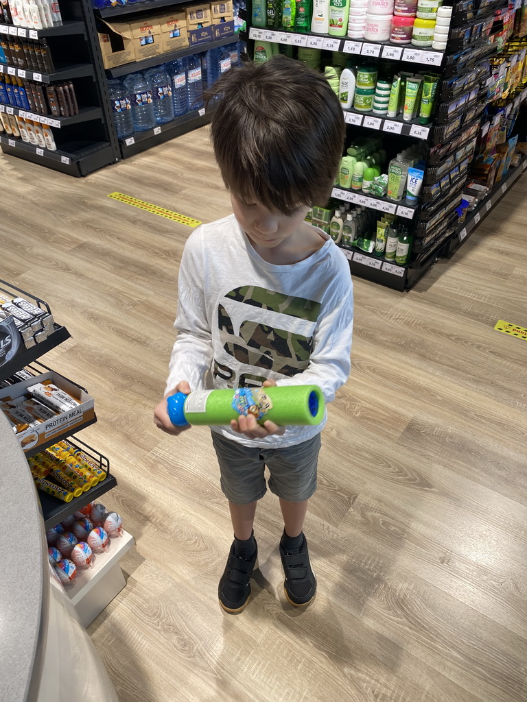 Max with a water gun at the supermarket at the Abora Buenaventura by Lopesan hotel
