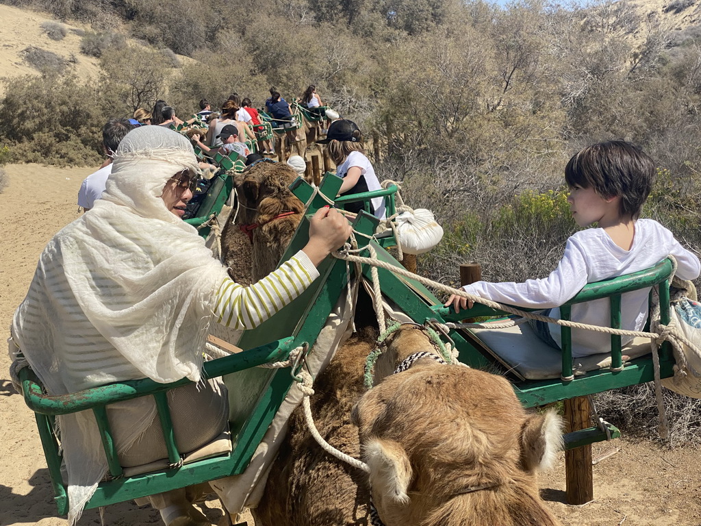 Miaomiao and Max on their Dromedary at the Maspalomas Dunes, viewed from Tim`s Dromedary, during the Camel Safari