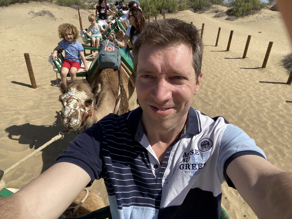 Guide and Miaomiao and Max on their Dromedary at the Maspalomas Dunes, viewed from Tim`s Dromedary, during the Camel Safari