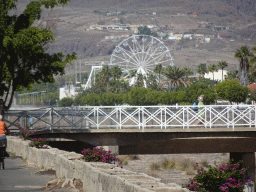 The bridge over the storm channel and the Ferris wheel at the Holiday World Maspalomas Center theme park