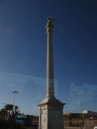 Column of Christopher Columbus at the Avenida Cristóbal Colón street, viewed from the tour bus to Puerto Rico