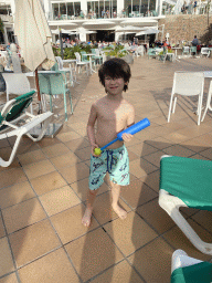 Max with a water gun at the west swimming pool at the Abora Buenaventura by Lopesan hotel