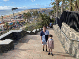 Tim and Max at the staircase from the Paseo Costa Canaria street to the Anexo II shopping mall, with a view on the Playa del Inglés beach and the Maspalomas Dunes