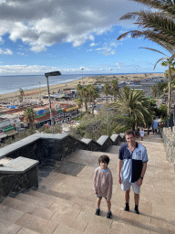Tim and Max at the staircase from the Paseo Costa Canaria street to the Anexo II shopping mall, with a view on the Playa del Inglés beach and the Maspalomas Dunes