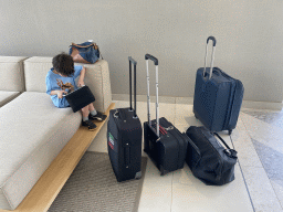 Max playing with iPad and our suitcases in the lobby of the Abora Buenaventura by Lopesan hotel