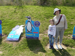 Miaomiao and Max with penguin cardboards at the outdoor area at the Sea Life Porto