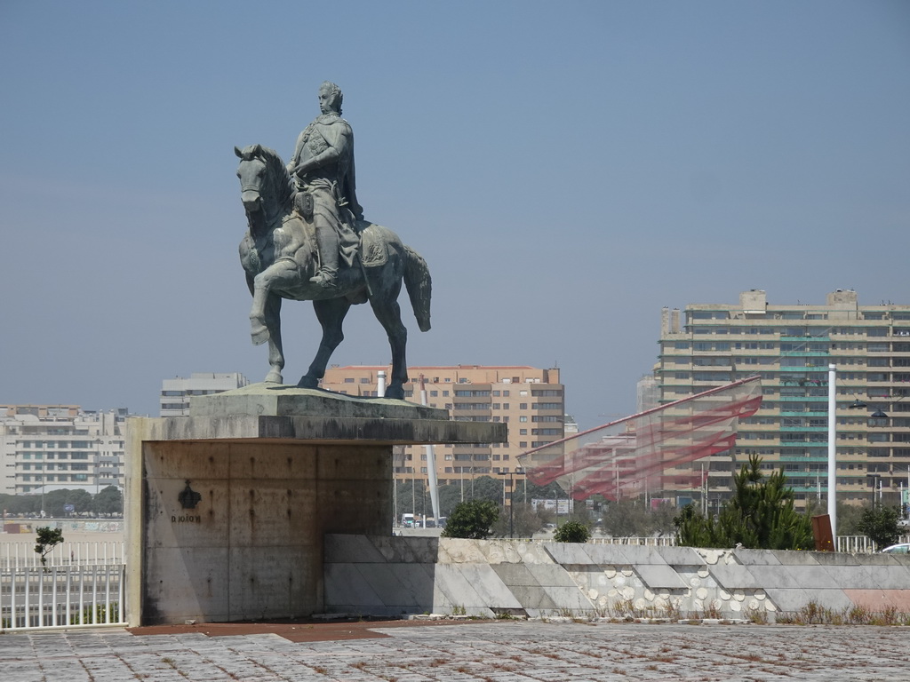 The Equestrian Statue of Don João VI at the Praça de Gonçalves Zarco square and the `She Changes` sculpture