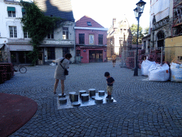 Miaomiao and Max on a playground on the Sint-Romboutskerkhof square