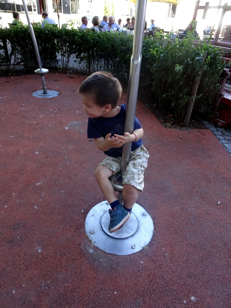 Max on a playground on the Sint-Romboutskerkhof square