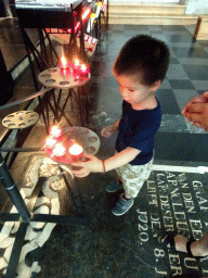 Max with candles at the northwest side of St. Rumbold`s Cathedral