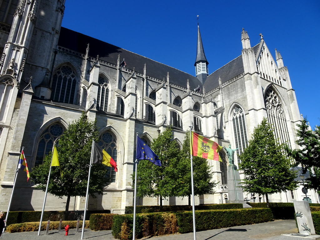 Banners at the southwest side of St. Rumbold`s Cathedral at the Onder-Den-Toren street
