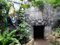 Statue and temple gate at the `Adembenemend Azië` building at the Asia section of ZOO Planckendael