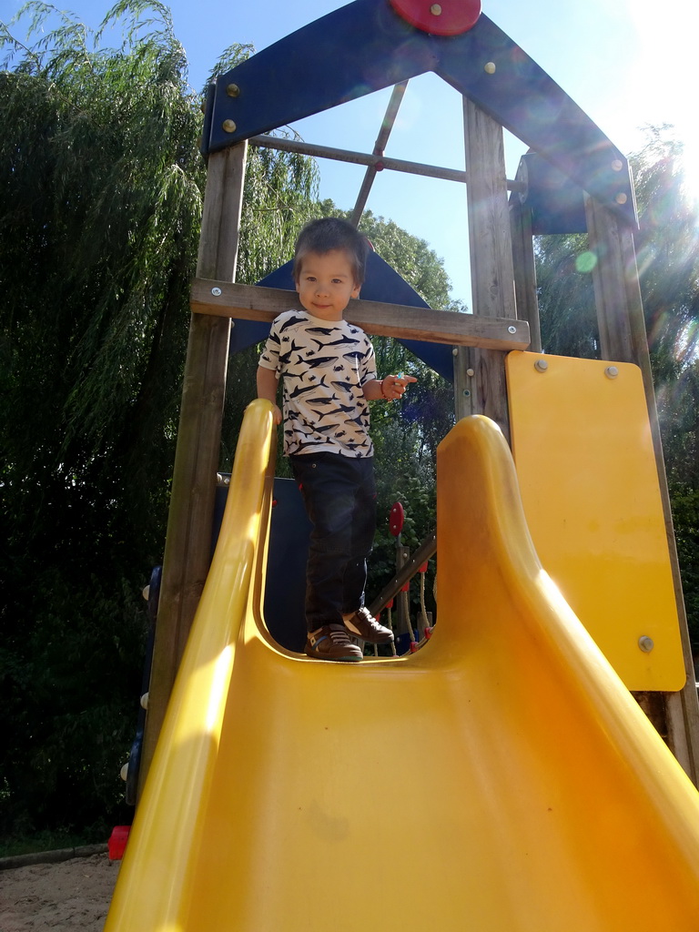 Max on a slide at the playground at the Africa section of ZOO Planckendael