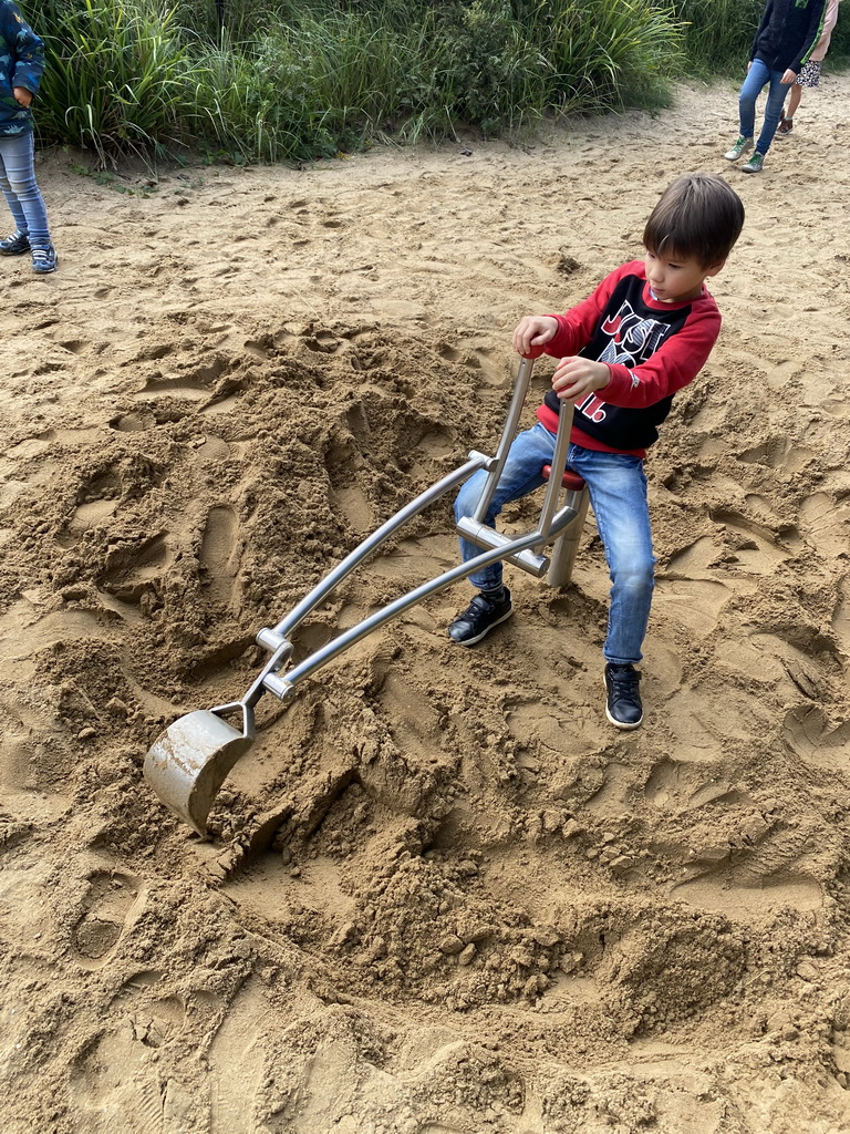 Max with a digger at the playground near Restaurant Toepaja at the Asia section of ZOO Planckendael