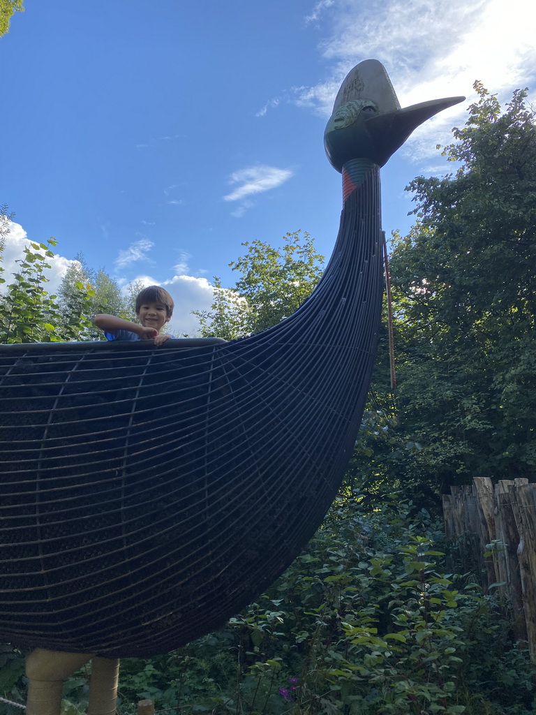 Max on a Cassowary statue at the Oceania section of ZOO Planckendael