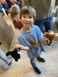 Max with plush animals at the souvenir store of ZOO Planckendael