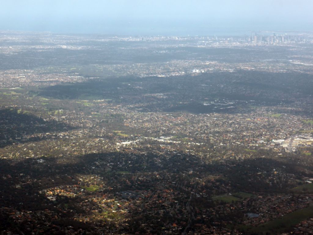 The northeast side of the city, skyscrapers in the city center and the coastline, viewed from the airplane from Sydney