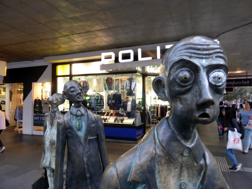 Sculpture `Three Businessmen Who Brought Their Own Lunch: Batman, Swanston and Hoddle` by Alison Weaver and Paul Quinn, at the crossing of Bourke Street and Swanston Street