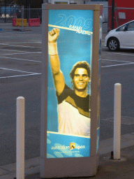 Poster of Rafael Nadal at the parking place of Melbourne Park, at sunset
