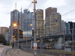 The railway and skyscrapers in the city center, viewed from the Rod Laver Arena / Melbourne Park tram stop, at sunset