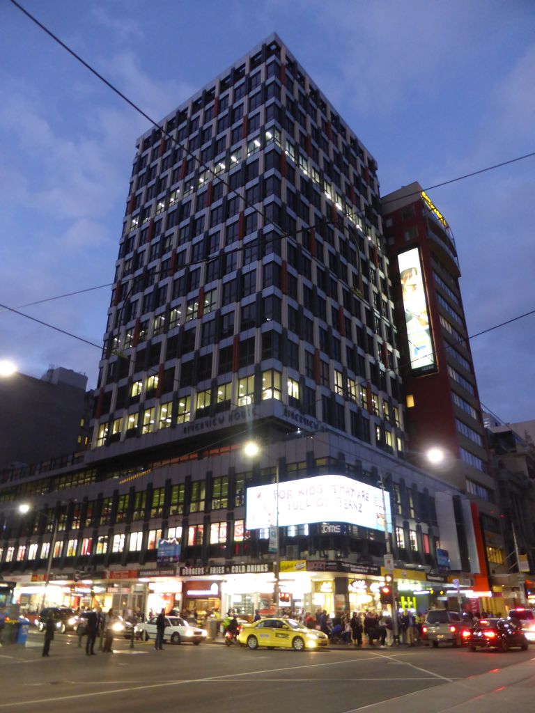 The Riverview House at the crossing of Flinders Street and Elizabeth Street, by night