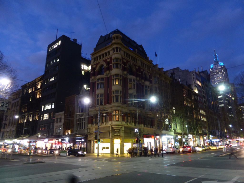 The crossing of Elizabeth Street and Collins Street, by night